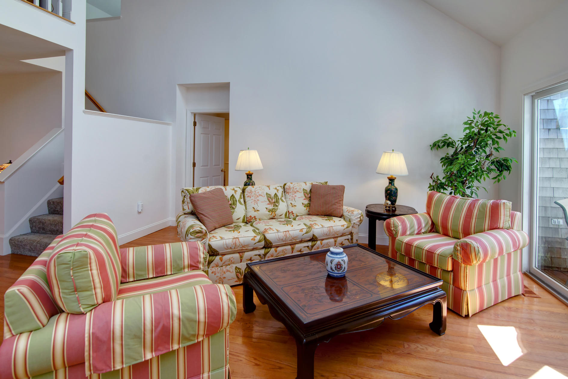 22 Stratford Ridge Mashpee, MA 02649 - Photo 4 of 35 a living room with furniture and a potted plant