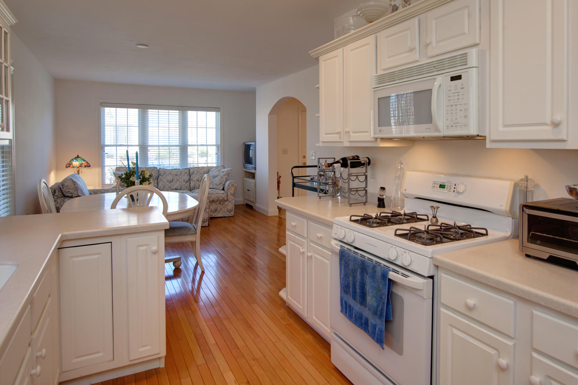 22 Stratford Ridge Mashpee, MA 02649 - Photo 10 of 35 a kitchen with a stove cabinets and wooden floor
