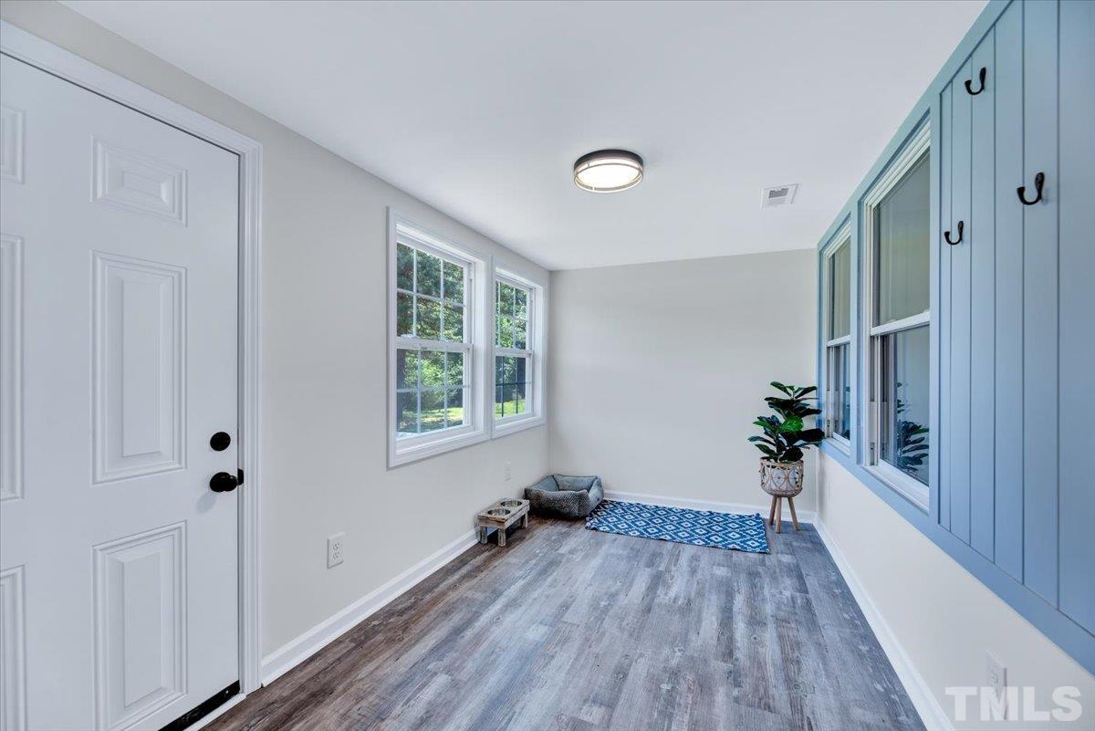 962 Laurel Mill-Centerville Road Louisburg, NC 27549 - Photo 16 of 36 a view of a room with wooden floor and a window