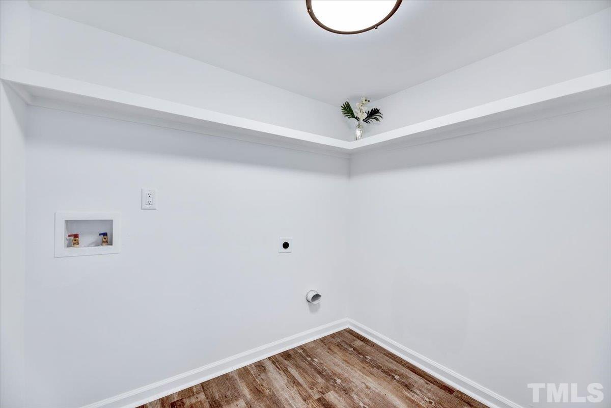 962 Laurel Mill-Centerville Road Louisburg, NC 27549 - Photo 18 of 36 a view of a room with racks on the wall