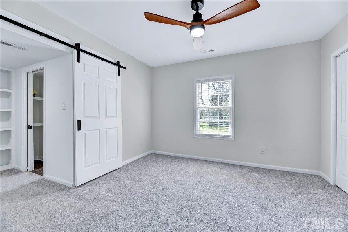 962 Laurel Mill-Centerville Road Louisburg, NC 27549 - Photo 19 of 36 a view of an empty room with a window