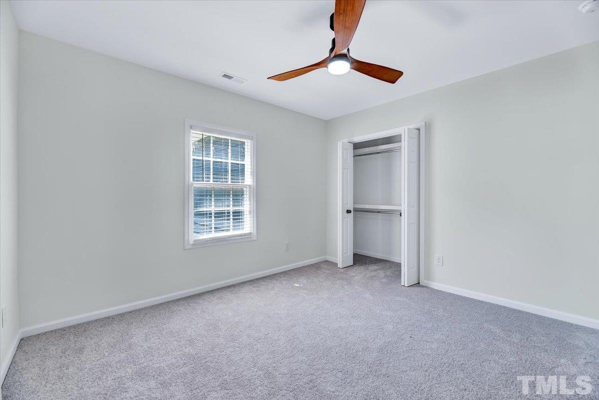 962 Laurel Mill-Centerville Road Louisburg, NC 27549 - Photo 20 of 36 a view of an empty room with a window