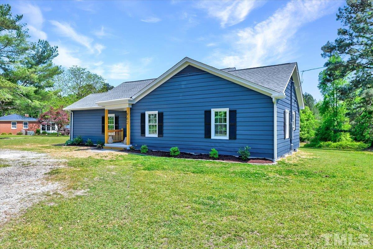 962 Laurel Mill-Centerville Road Louisburg, NC 27549 - Photo 2 of 36 a view of a house with yard and tree s