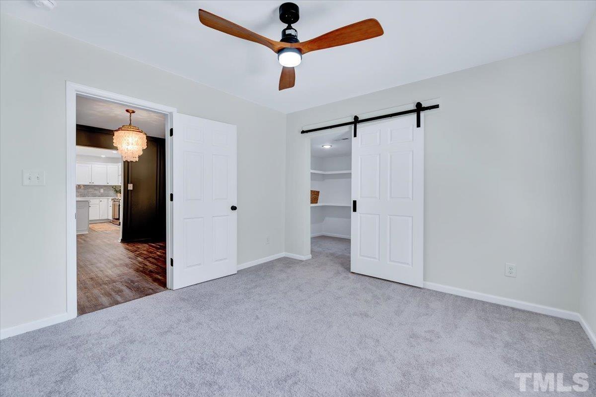 962 Laurel Mill-Centerville Road Louisburg, NC 27549 - Photo 21 of 36 a view of empty room with ceiling fan