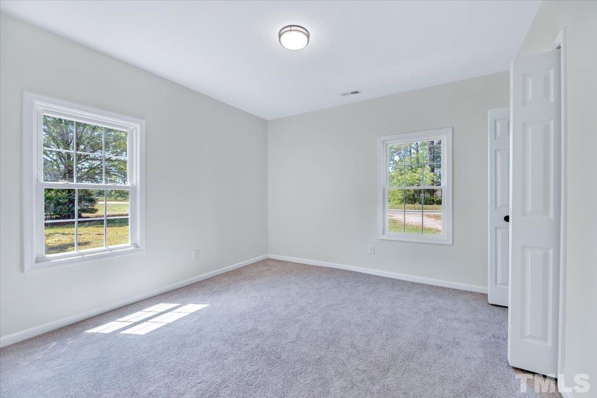 962 Laurel Mill-Centerville Road Louisburg, NC 27549 - Photo 28 of 36 a view of an empty room with a window