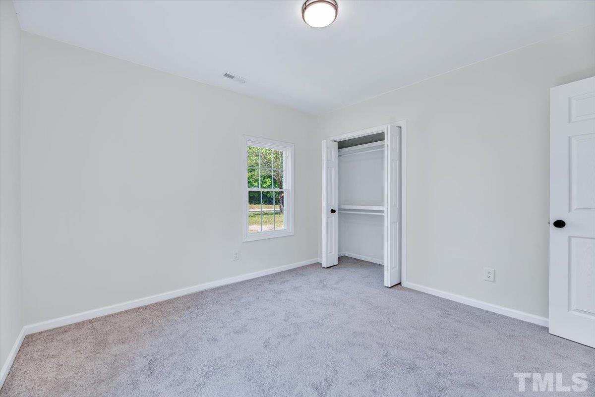 962 Laurel Mill-Centerville Road Louisburg, NC 27549 - Photo 29 of 36 a view of an empty room with a window
