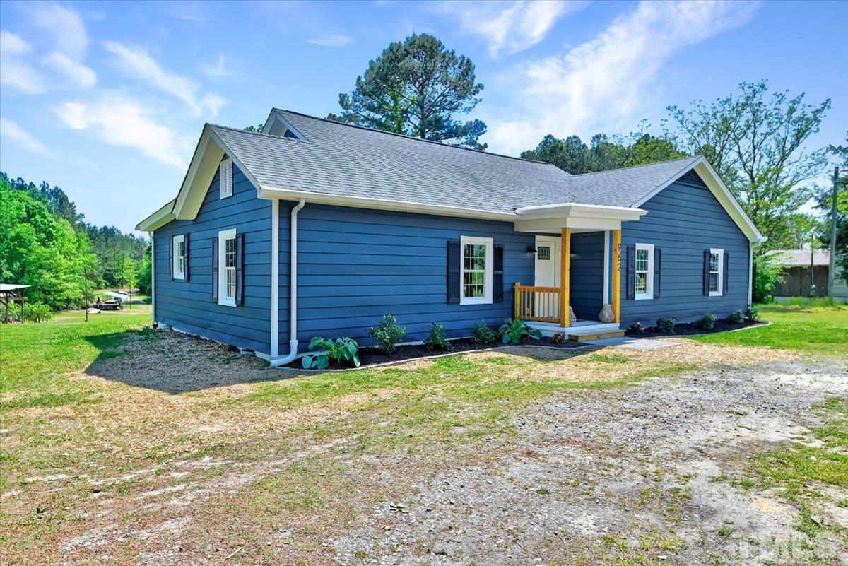 962 Laurel Mill-Centerville Road Louisburg, NC 27549 - Photo 3 of 36 a view of a house with backyard and garden
