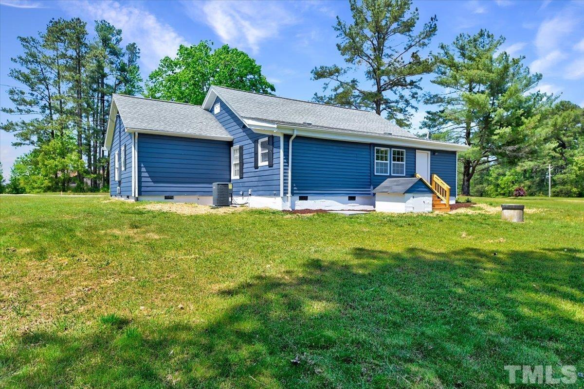 962 Laurel Mill-Centerville Road Louisburg, NC 27549 - Photo 35 of 36 a view of a house with a yard