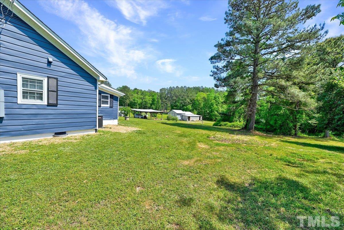 962 Laurel Mill-Centerville Road Louisburg, NC 27549 - Photo 36 of 36 a view of a backyard with a garden