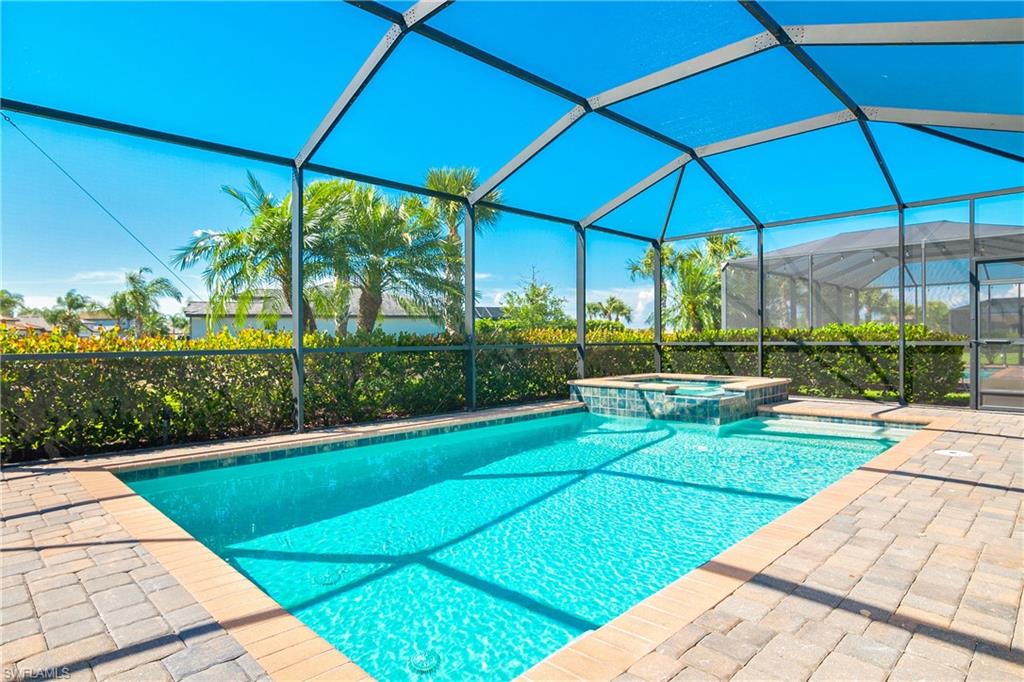 19952 Beverly Park Road Estero, FL 33928 - Photo 20 of 32 a view of a backyard with a garden and plants