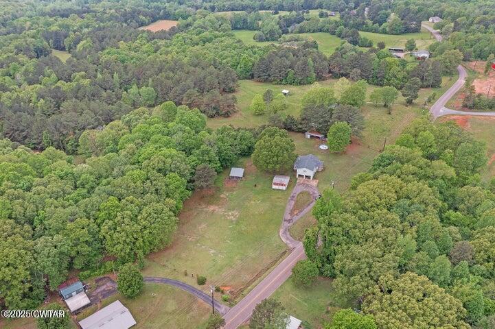 5060 Enville Road Henderson, TN 38340 - Photo 16 of 17 an aerial view of residential house with outdoor space