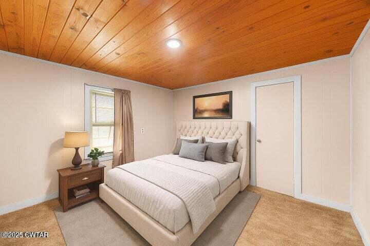 5060 Enville Road Henderson, TN 38340 - Photo 3 of 17 a bedroom with a bed and a night stand