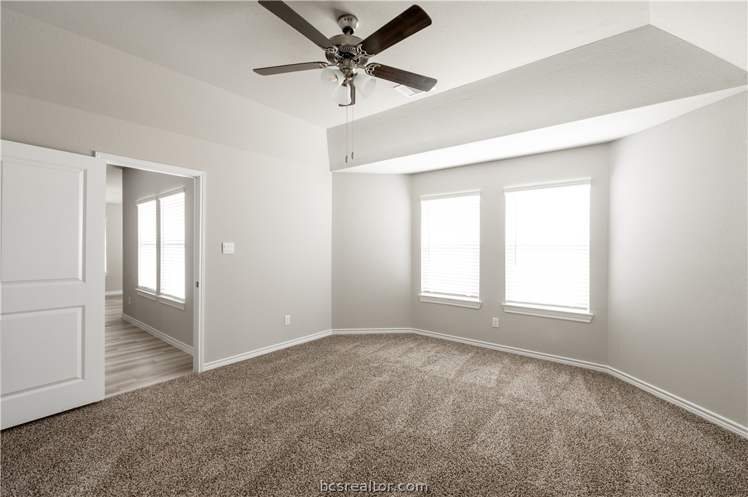 2159 Chief Street Bryan, TX 77807 - Photo 14 of 22 an empty room with fan and windows