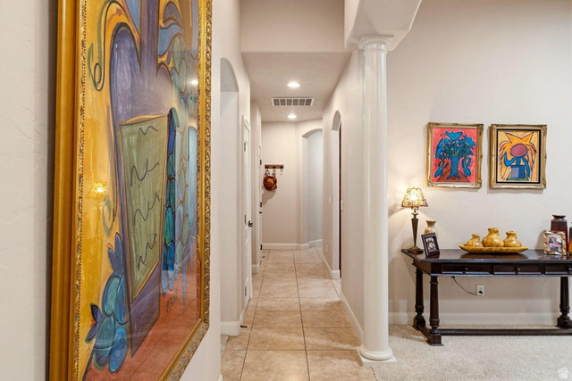 1609 East 10 S Street St. George, UT 84790 - Photo 26 of 68 Hallway featuring recessed lighting, a decorative column, neutral wall tones, arched doorways, and tile flooring