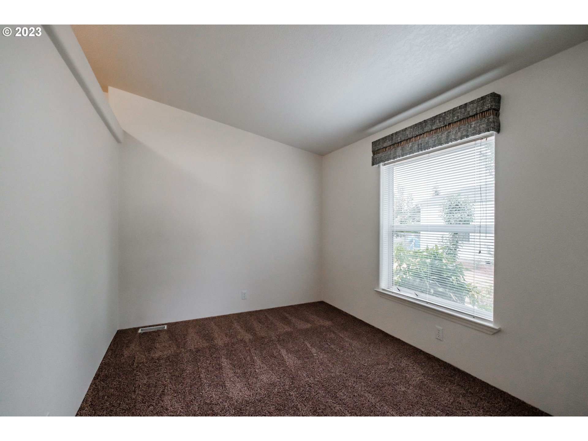 2434 Maia Loop Springfield, OR 97477 - Photo 13 of 36 a view of an empty room and window