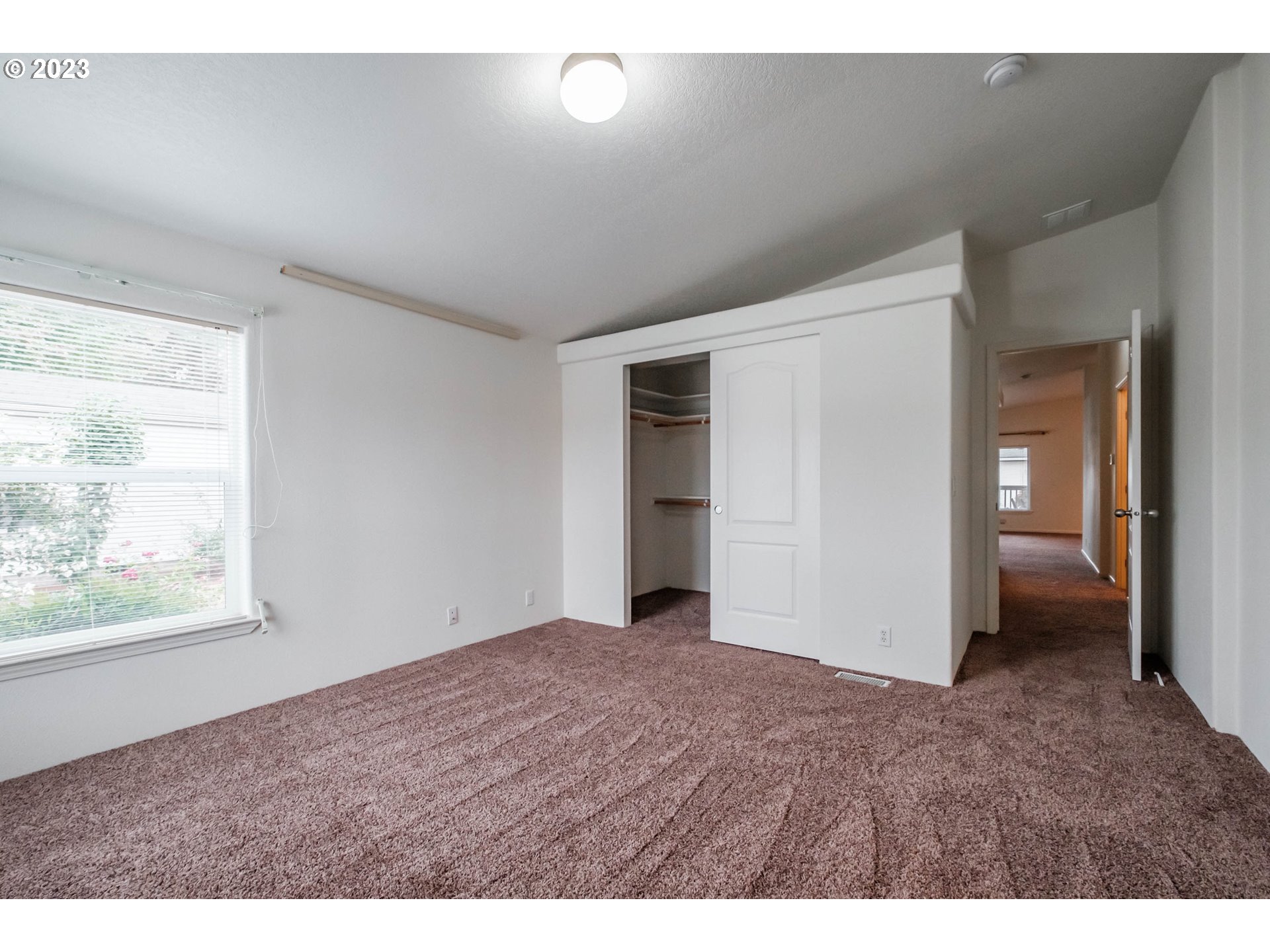 2434 Maia Loop Springfield, OR 97477 - Photo 23 of 36 a view of a big room with closet and wooden floor