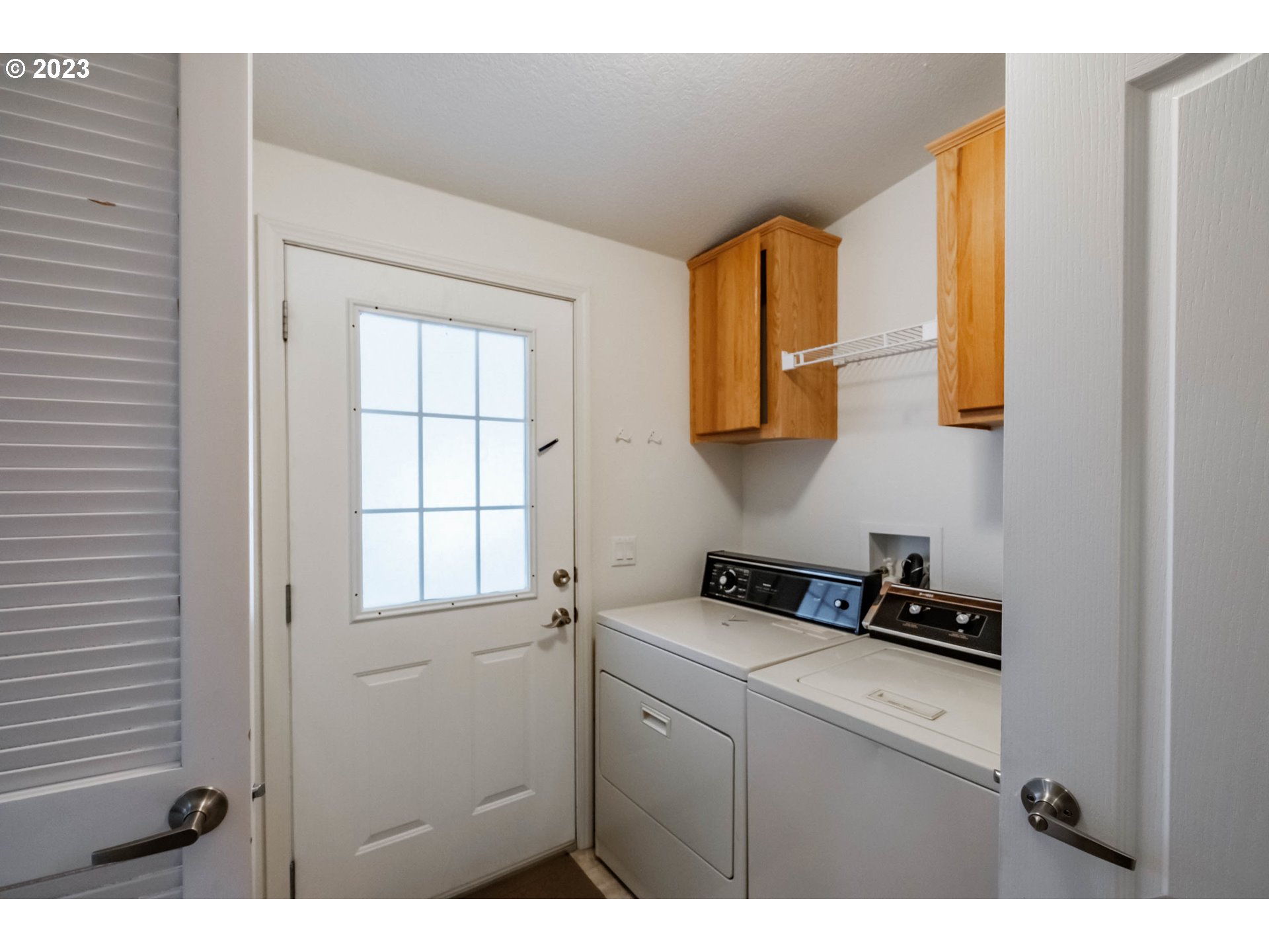 2434 Maia Loop Springfield, OR 97477 - Photo 26 of 36 a bathroom with a sink a mirror and a window