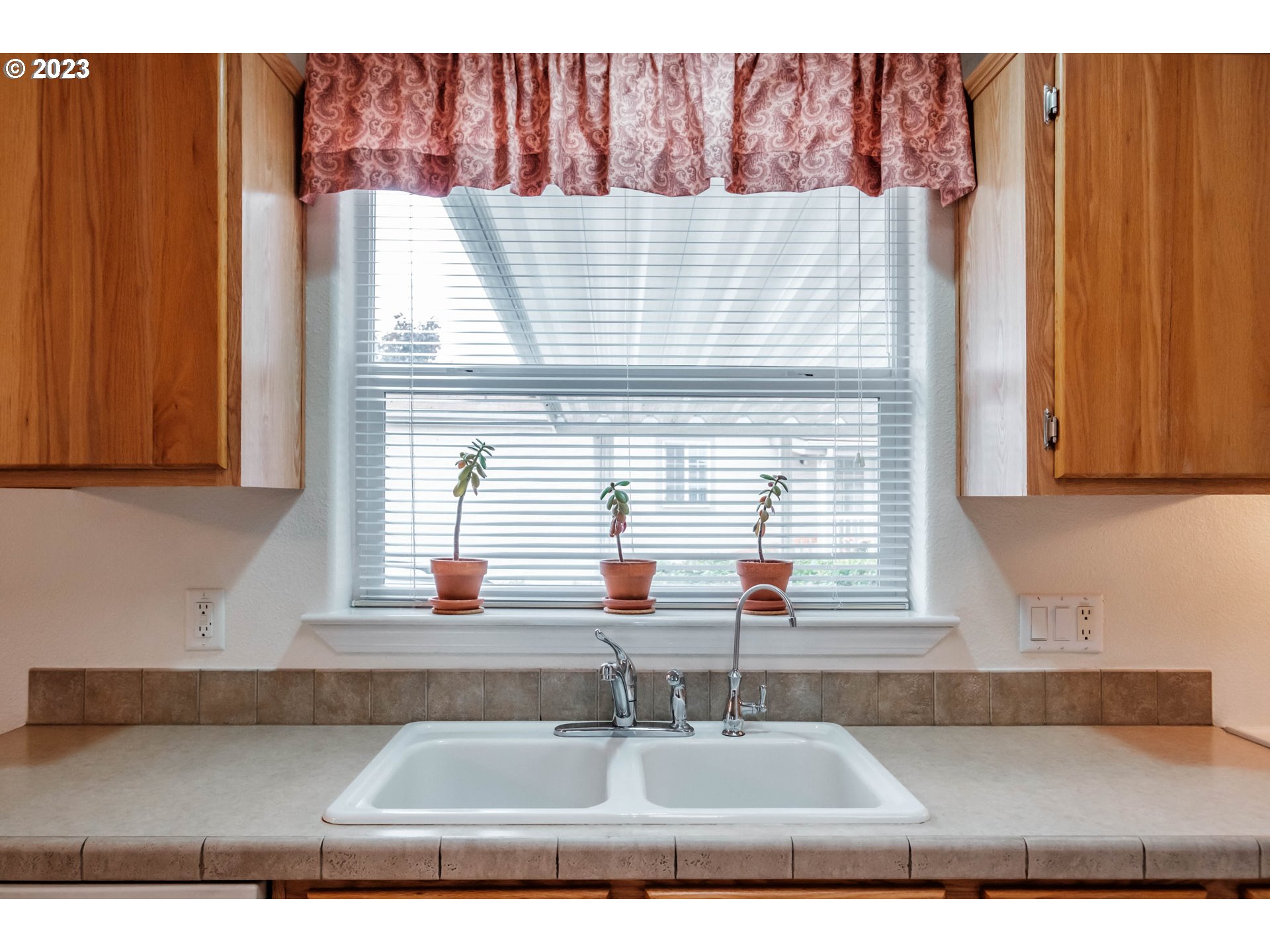 2434 Maia Loop Springfield, OR 97477 - Photo 10 of 36 a kitchen with a sink cabinets and window