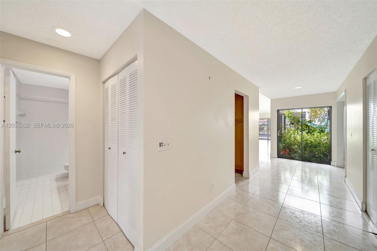 5223 Gate Lake Road, Unit 5223 Tamarac, FL 33319 - Photo 2 of 37 a view of an entryway with wooden floor