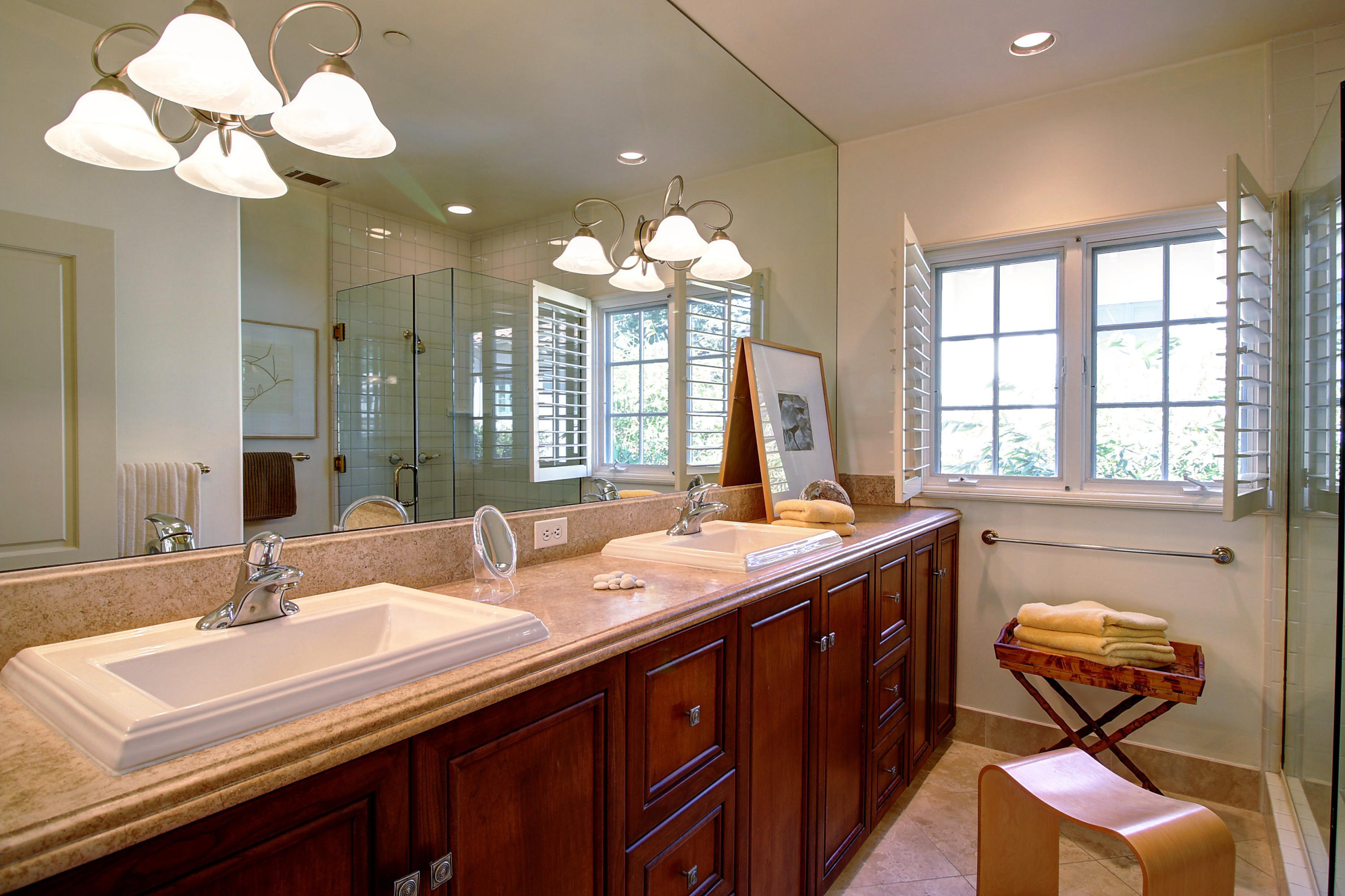 71 Olive Mill Road Montecito, CA 93108 - Photo 12 of 22 a bathroom with a sink a vanity and a large mirror