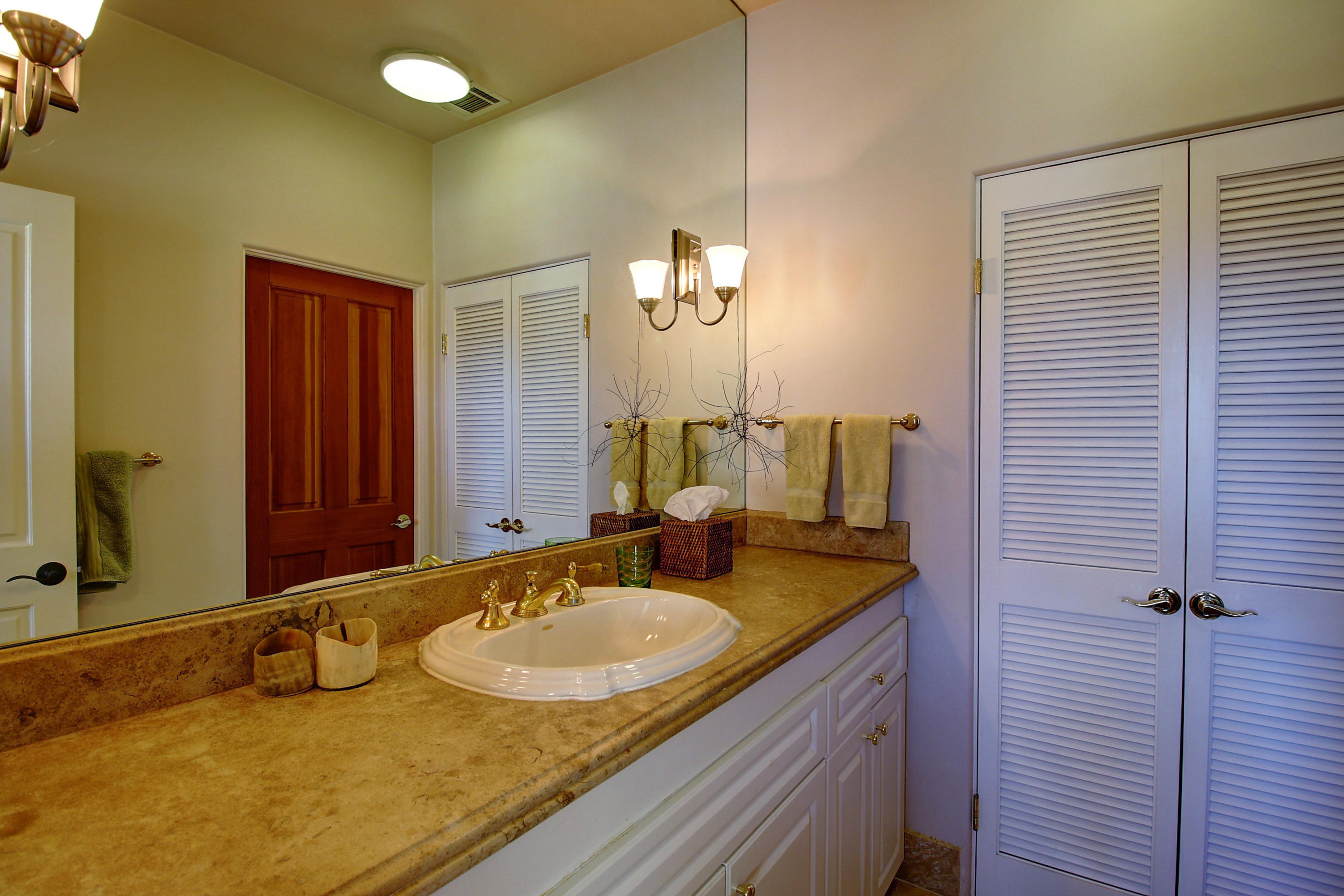 71 Olive Mill Road Montecito, CA 93108 - Photo 16 of 22 a bathroom with a granite countertop sink and a mirror