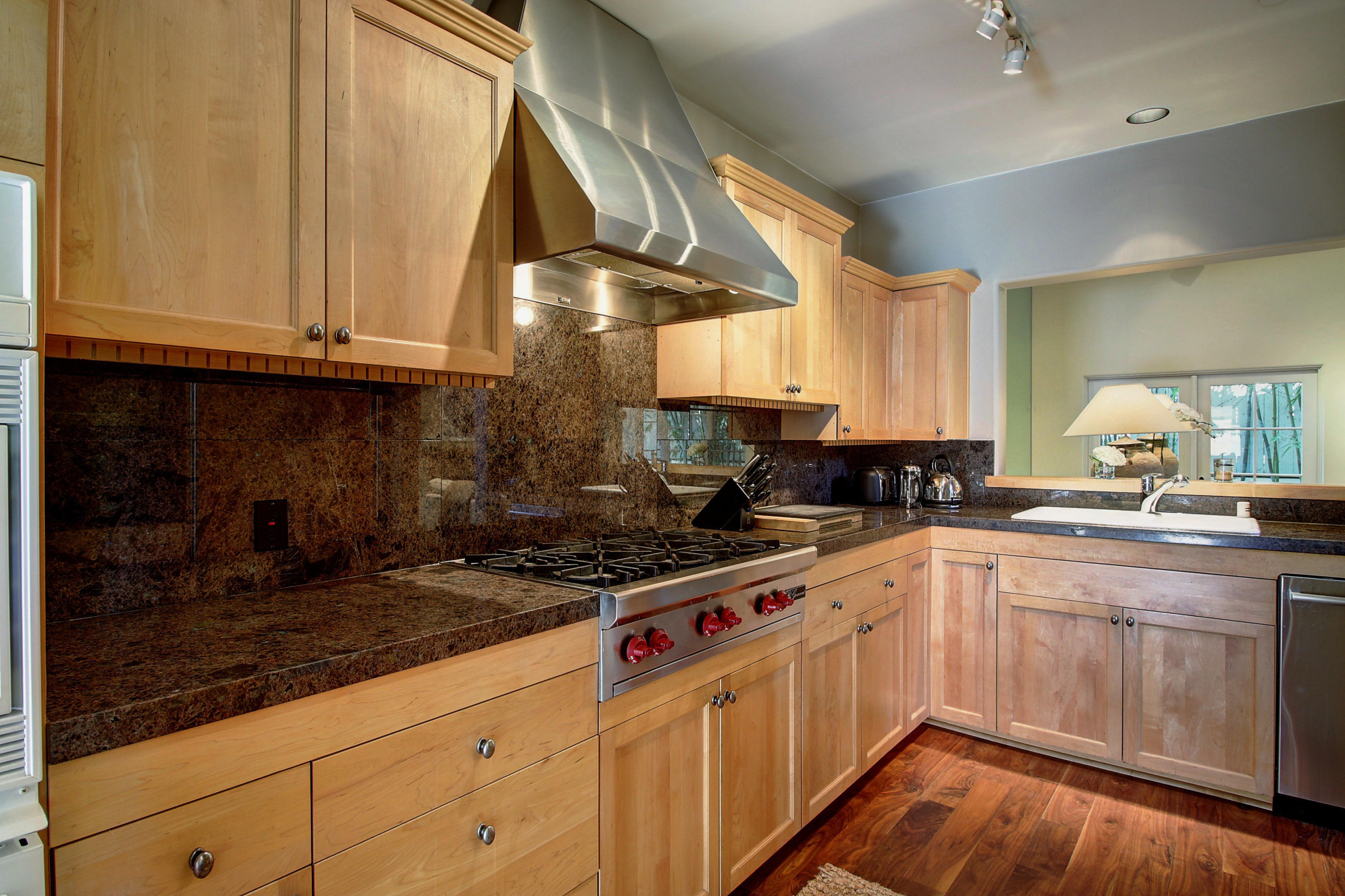 71 Olive Mill Road Montecito, CA 93108 - Photo 5 of 22 a kitchen with granite countertop a sink a stove and cabinets