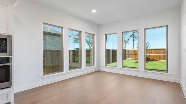 a view of room with balcony and floor to ceiling window