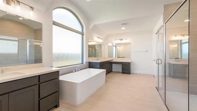 a large bathroom with a double vanity sink a large mirror and shower