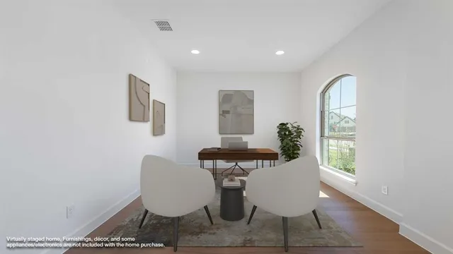 a dining room with furniture and wooden floor