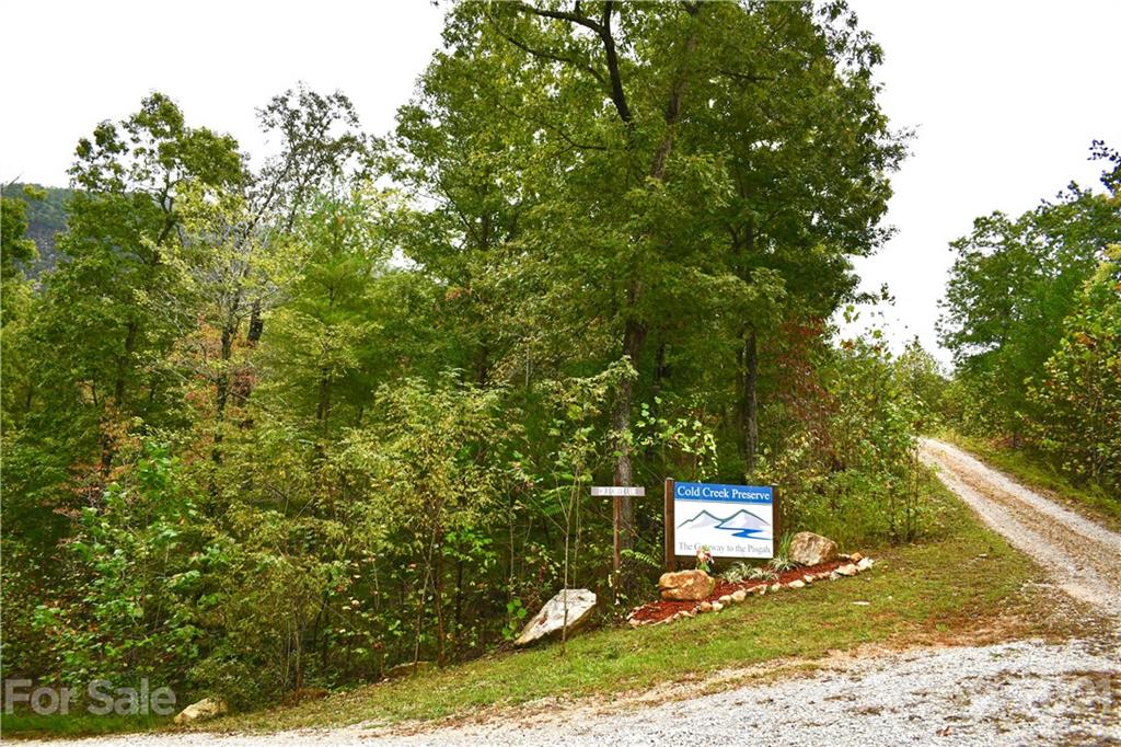 Lot 10 Dobsons Knob Loop Road, Unit 10 Marion, NC 28752 - Photo 11 of 21 a sign that is sitting in front of a tree