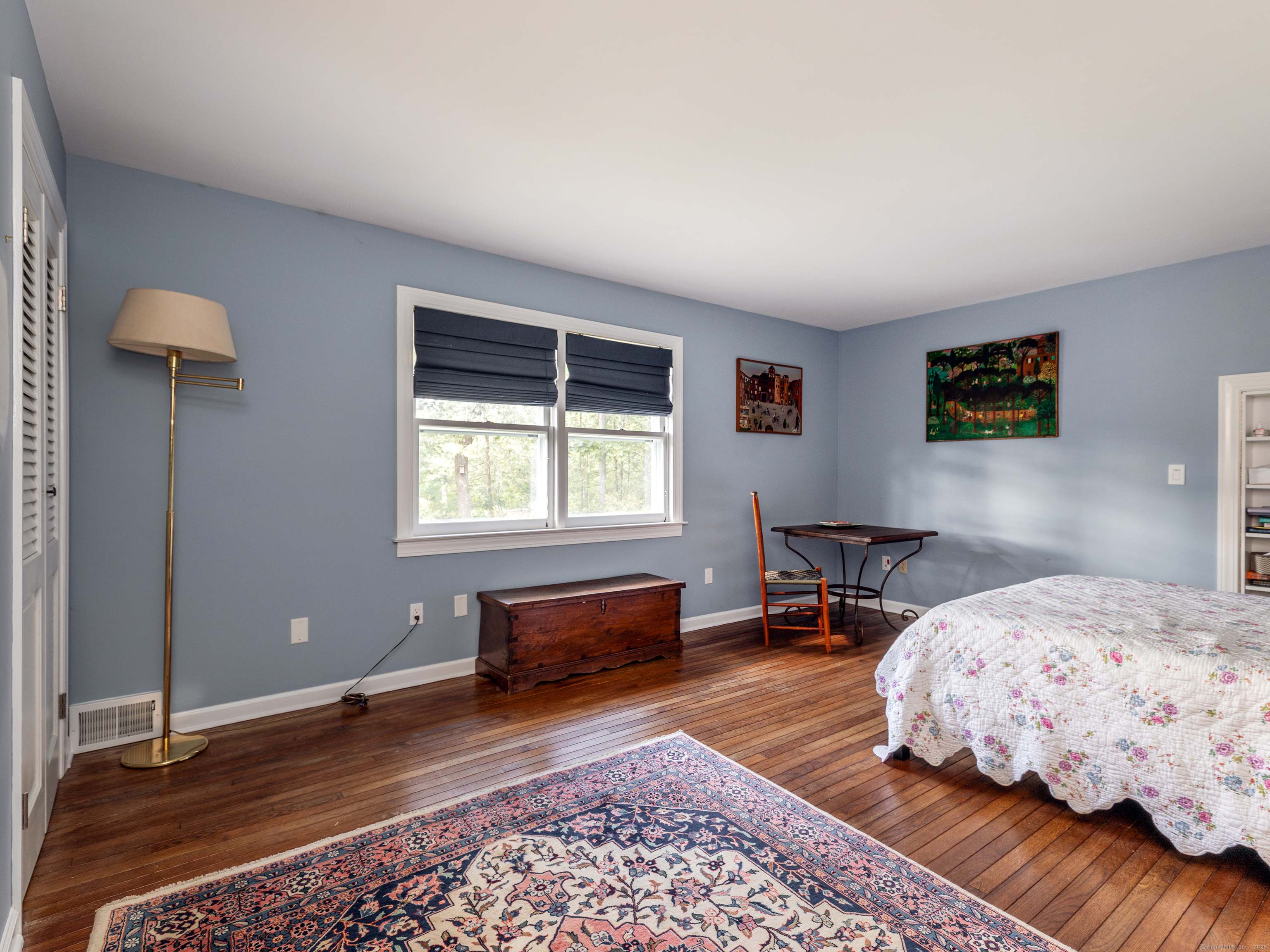 31 Hickory Lane Roxbury, CT 06783 - Photo 23 of 37 a bedroom with a bed and wooden floor