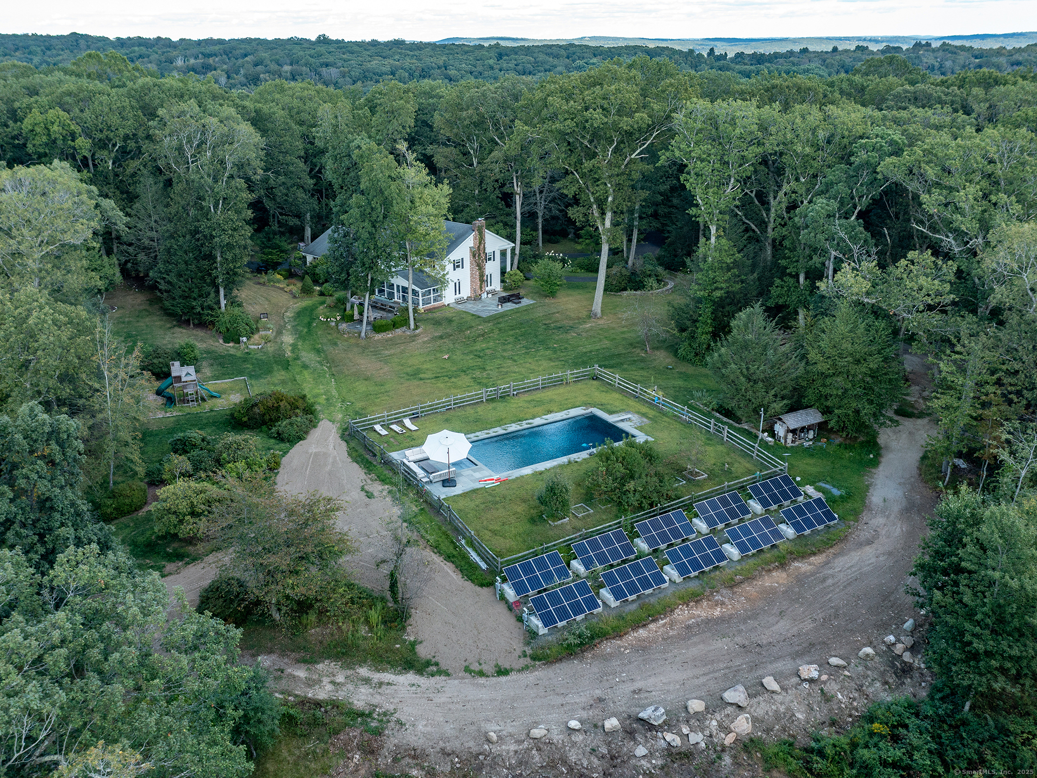 31 Hickory Lane Roxbury, CT 06783 - Photo 32 of 37 a view of a garden with a building in the background
