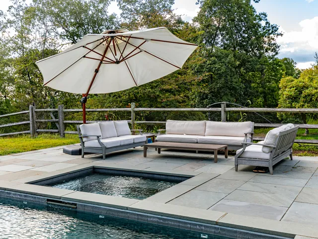 a view of sitting area with swimming pool and sitting area