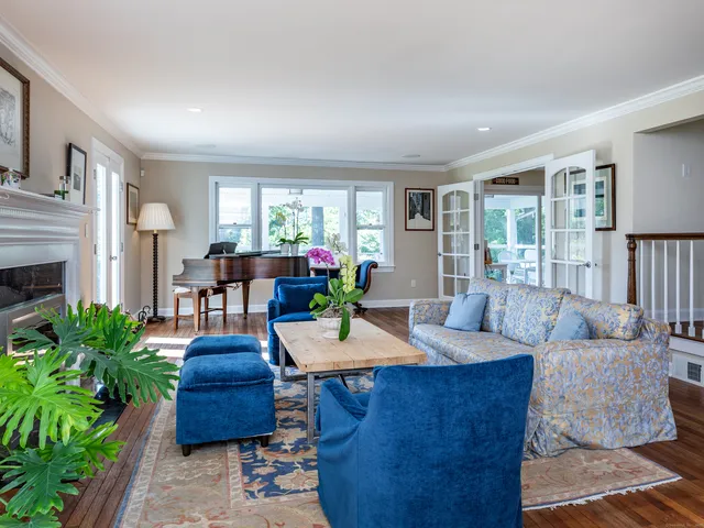 a view of a livingroom with furniture window and wooden floor