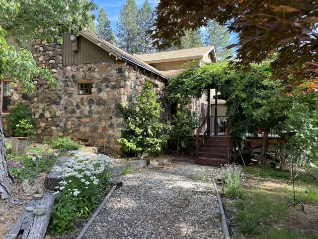 a backyard of a house with lots of green space