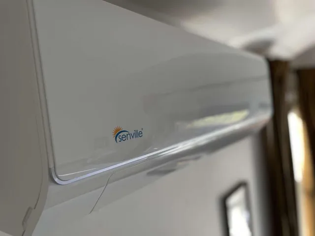 a bedroom with a bed and a mirror