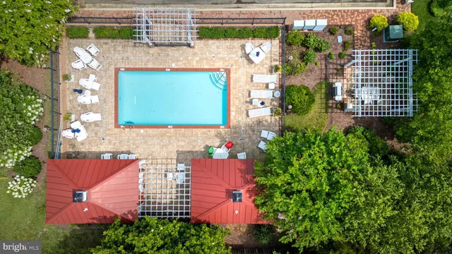 an aerial view of a house with a yard and garden