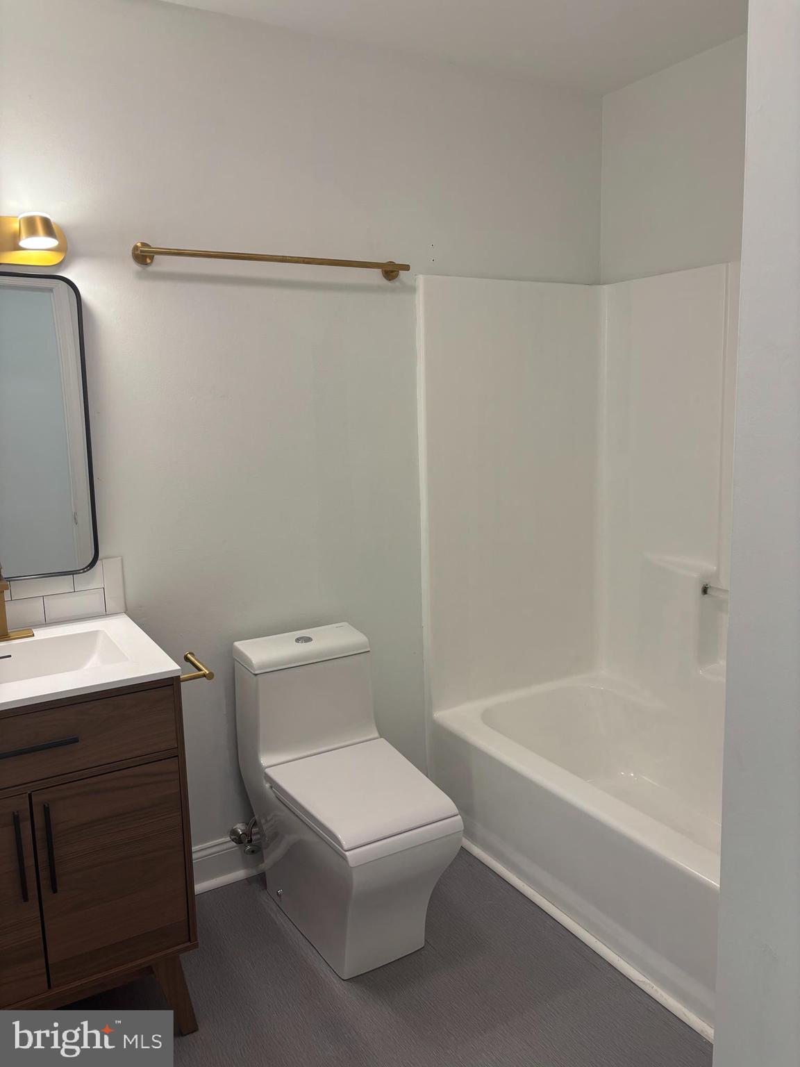 606 Gray Mt Circle Elkton, MD 21921 - Photo 10 of 13 a bathroom with a sink a toilet and shower