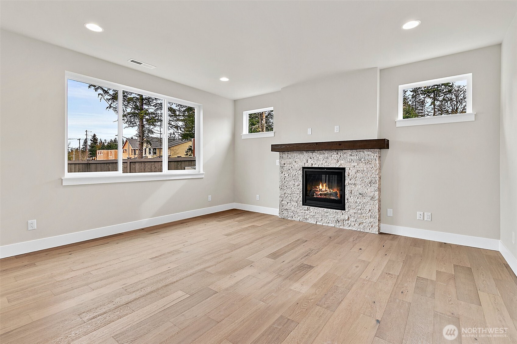 19129 Meridian Drive Southeast, Unit CW19 Bothell, WA 98012 - Photo 15 of 29 a view of an empty room with wooden floor and a window