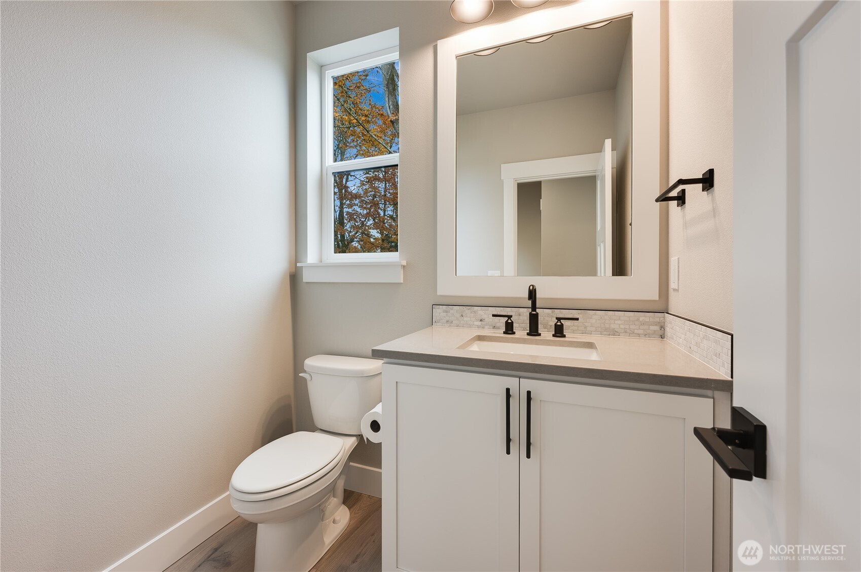 19129 Meridian Drive Southeast, Unit CW19 Bothell, WA 98012 - Photo 3 of 29 a bathroom with a toilet sink and mirror