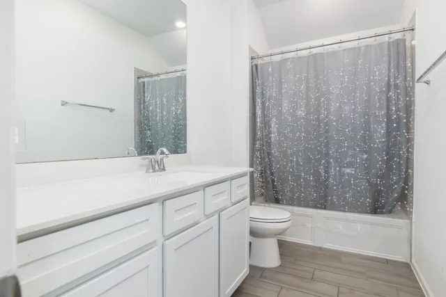 a bedroom with a bed and a chair