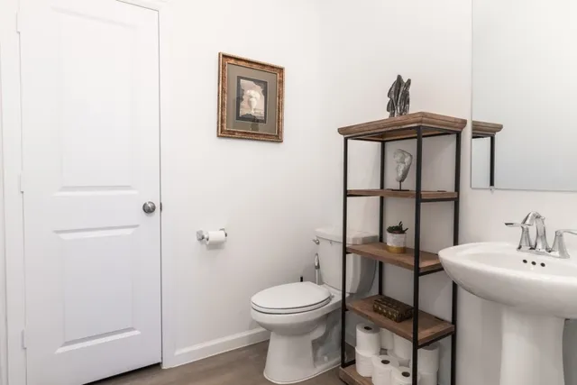 a large kitchen with kitchen island a sink table and chairs