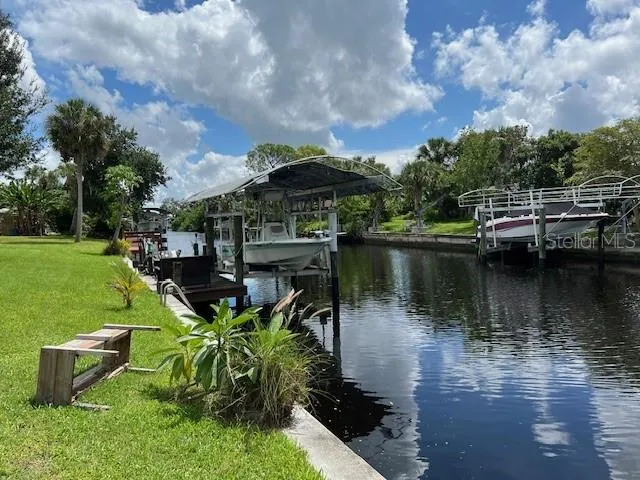 a view of a lake with a house in the background
