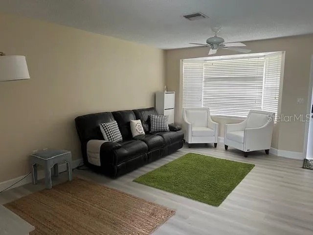 a living room with furniture and a rug