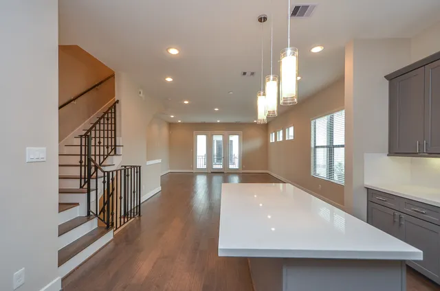 a view of an entryway with wooden floor