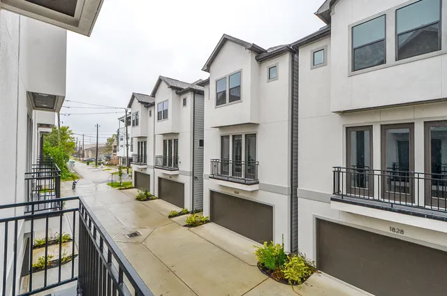 a view of a house with roof and sitting area