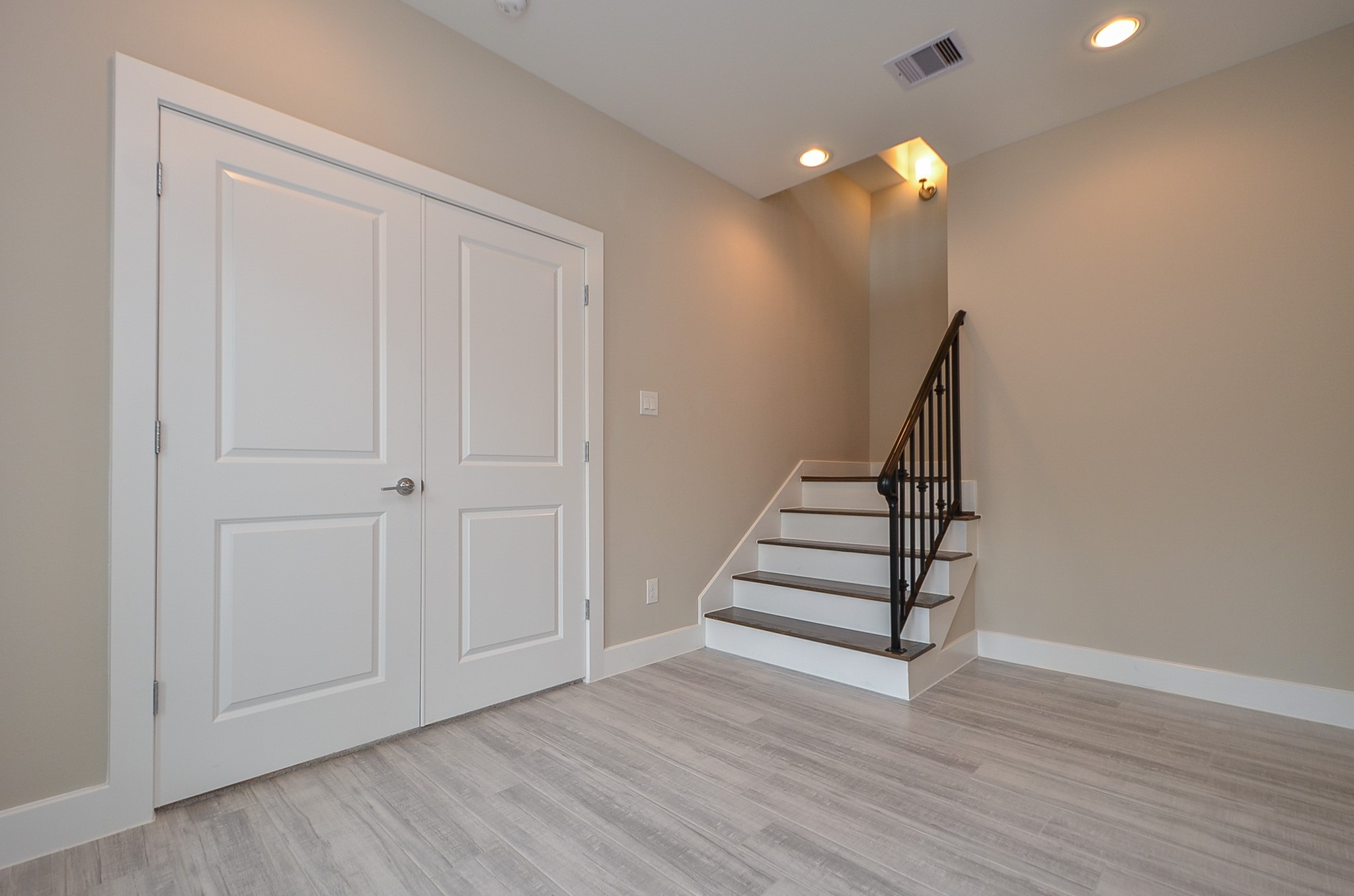 1818 Bonner Street Houston, TX 77007 - Photo 5 of 26 wooden floor in an empty room with stairs