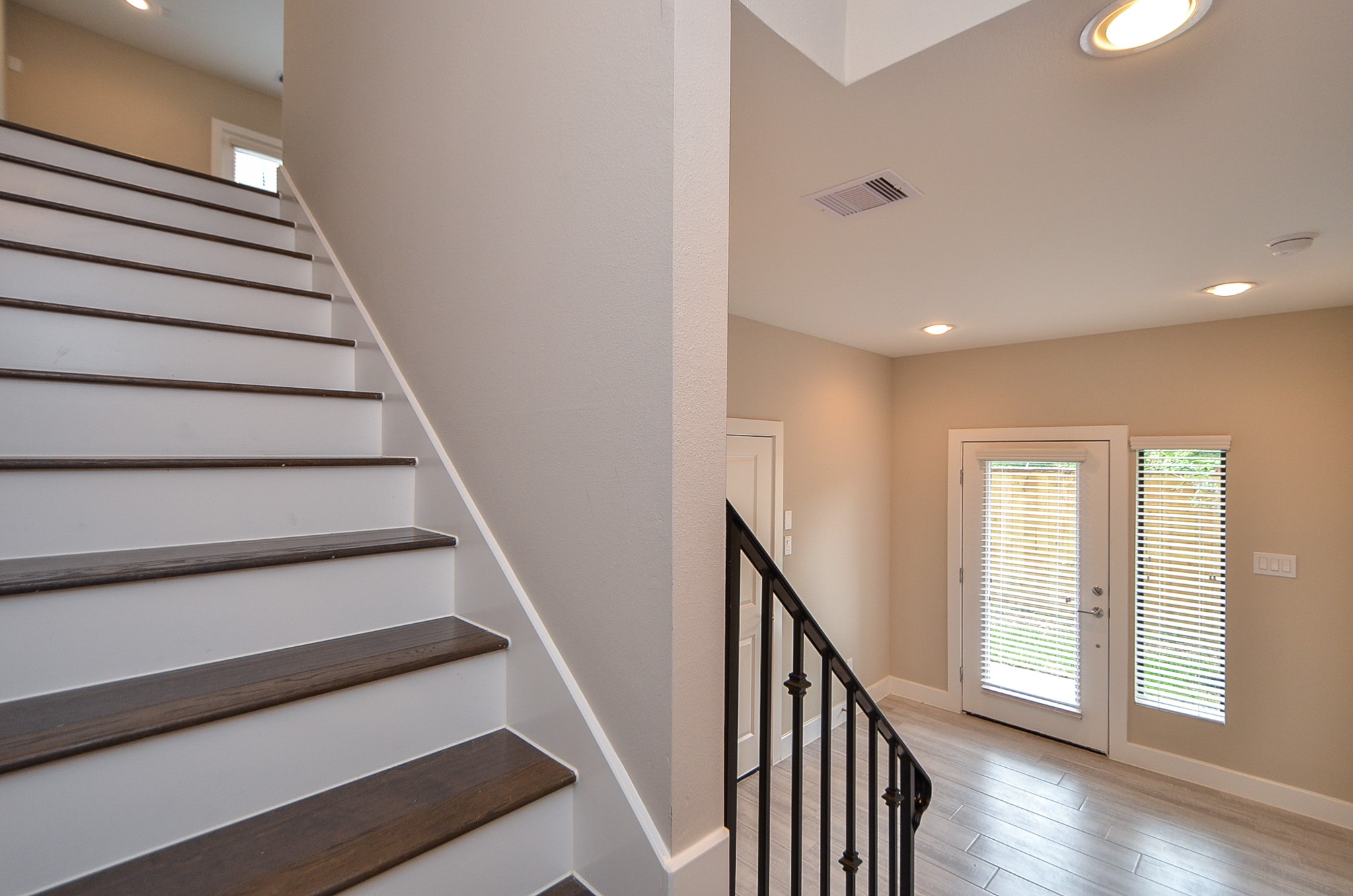 1818 Bonner Street Houston, TX 77007 - Photo 7 of 26 a view of entryway with wooden floor and stairs