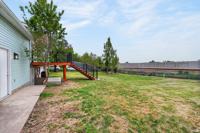 489 Owens Street Layton, UT 84041 - Photo 24 of 25 Fenced yard with stairway