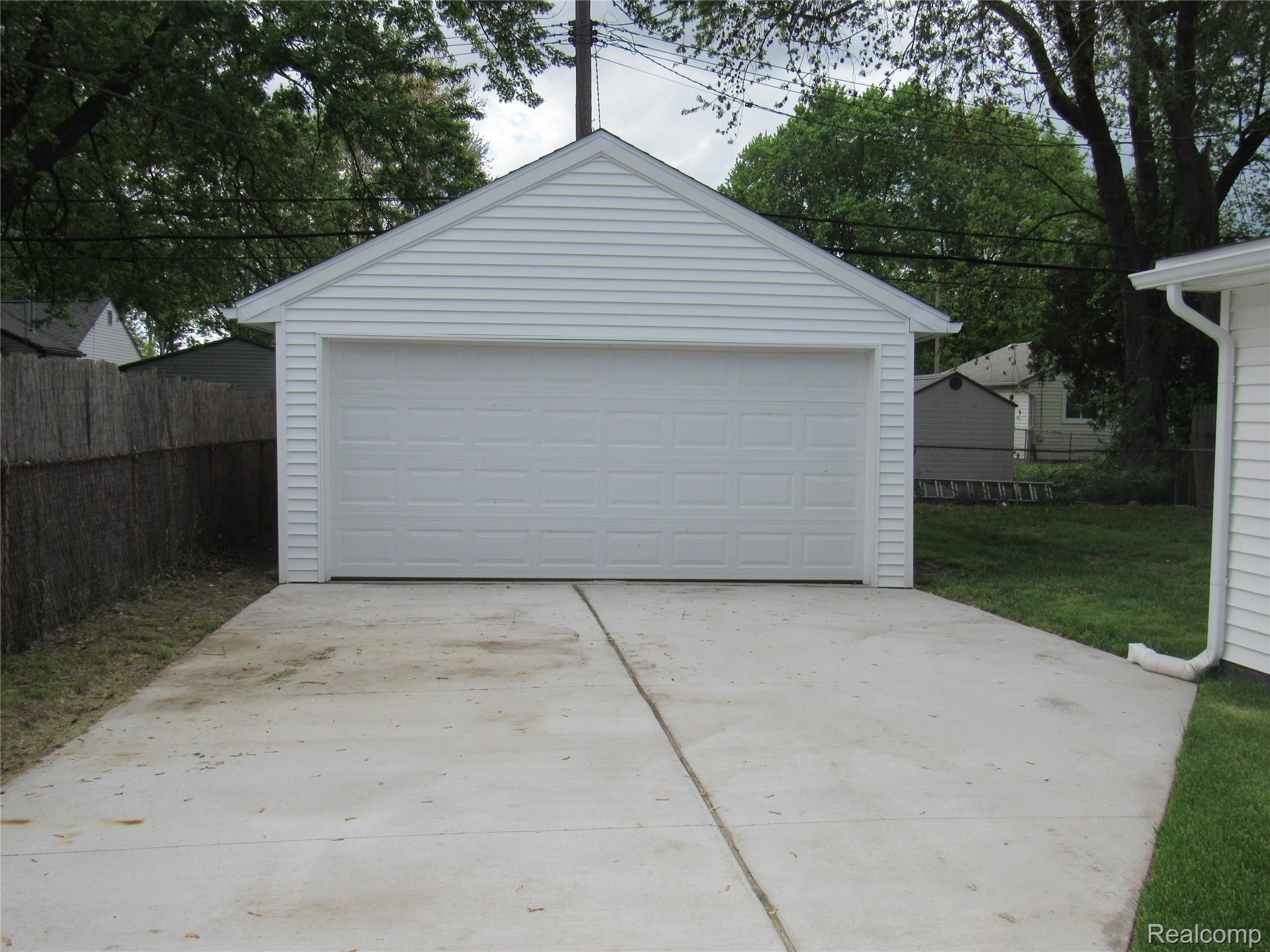 6764 Harding Street Taylor, MI 48180 - Photo 30 of 37 Deep garage with 10' wide brand new driveway and brand new Roof, Door and siding!